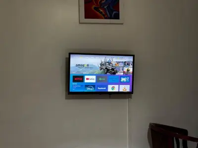a flat screen tv hanging on a wall at Njiro Climax in Arusha