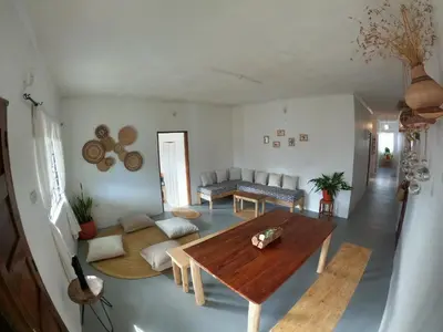 a living room with a table and a couch at Nomads nest safari house in Arusha