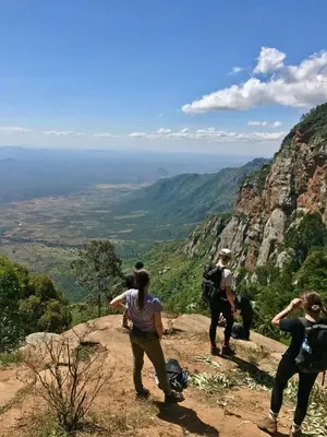 a group of people standing on top of a mountain at Nomads nest safari house in Arusha