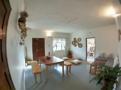 a living room with a table and a couch at Nomads nest safari house in Arusha