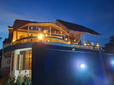 a house with a boat on top of it at Hill View Garden Hotel in Moshi