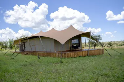 a tent in the middle of a field at Anantya Serengeti in Serengeti