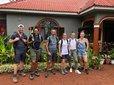 a group of people standing in front of a house at Home Feeling Kilimanjaro in Moshi