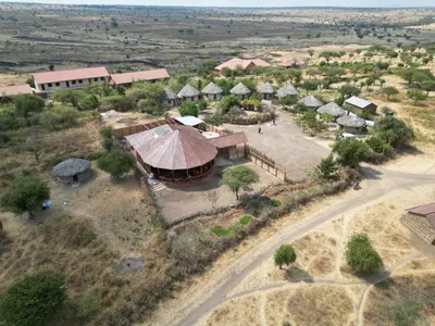 an aerial view of a village with a building at Maasai Eco Boma & Lodge - Experience Maasai Culture in Makuyuni