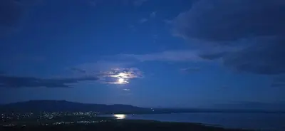 a moonlit view of a city at night at Panorama Safari Camp in Mto wa Mbu