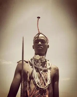 a statue of a woman with a stick on her head at Olkeri Camp in Olmotoni