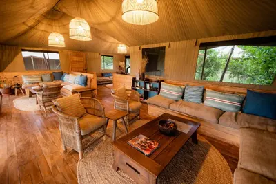 a living room with a couch and a table at Olkeri Camp in Olmotoni