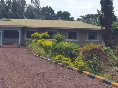 a house with a pathway in front of it at Sinana country Home-Backpackers Stay in Kibongoto