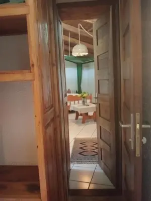 a door leading into a room with a living room at Dik Dik Hotel in Arusha