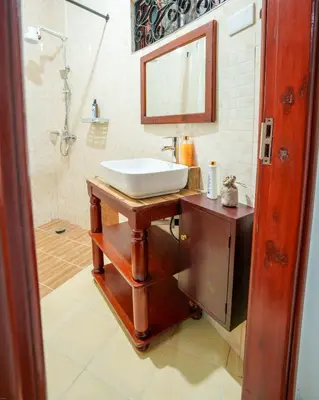 a bathroom with a sink and a shower at Sprunger Avenue - tulia homes in Moshi