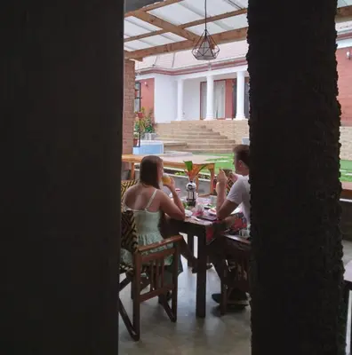 a group of people sitting at a table at Sprunger Avenue - tulia homes in Moshi