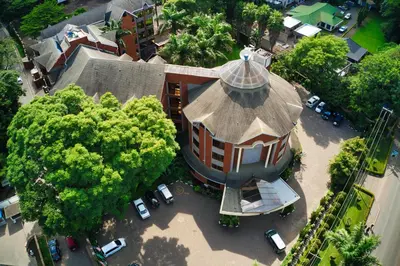 an overhead view of a large building with a tower at Kibo Palace Hotel Arusha in Arusha