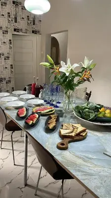 a table with plates of food on top of it at Kilimanjaro Twin Rooms Queen Beds in Moshi