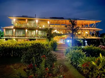 a building with lights on it at night at Mount Kilimanjaro 360 view Cottage in Uru