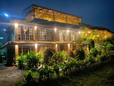 a building with lights on it at night at Mount Kilimanjaro 360 view Cottage in Uru