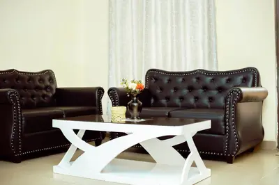 a living room with a couch and a coffee table at BCB Homes in Moshi