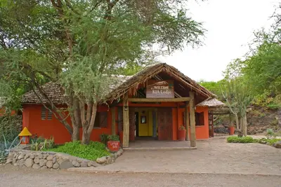a small orange building with a sign on it at Kia Lodge in Arusha