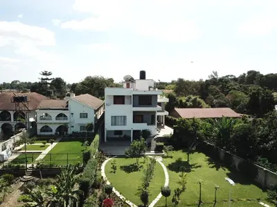 an aerial view of a house with a yard at Simba Villa in Arusha