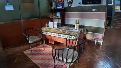 a bar with two chairs and a table in a store at Korona Villa Lodge in Arusha