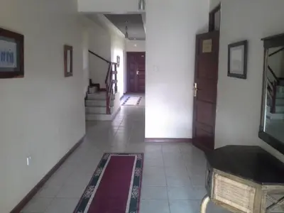 a room with a hallway with a staircase and a door at The Milimani Lodge in Arusha