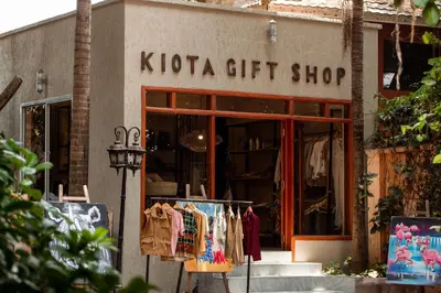 a kota gift shop with clothes on display in front at Tulia Boutique Hotel & Spa in Arusha