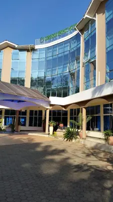 a large office building with a lot of windows at Corridor Springs Hotel in Arusha