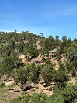 a group of houses on top of a hill at Uvi House & Restaurant in Mntindili