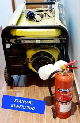 a machine with a sign that says stand by generator at Tamaduni Homestay & Lodge in Arusha