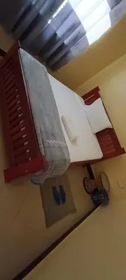 a container is hanging on the wall in a room at Kilimanjaro Budget Lodge in Msaranga