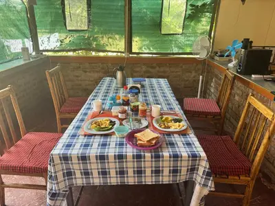 a table with plates of food on top at Seven Seven B&B in Arusha