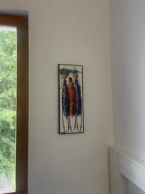 a picture hanging on a wall in a room at Seven Seven B&B in Arusha