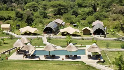 an aerial view of a resort with a pool and tents at Africa Safari Rift Valley in Magara