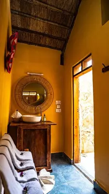 a bathroom with a sink and a mirror at Africa Safari Rift Valley in Magara