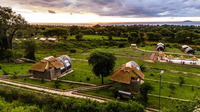 an aerial view of a village with huts at Africa Safari Rift Valley in Magara