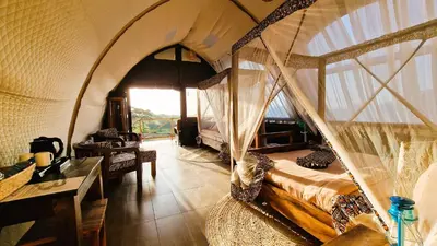 a bedroom with a hammock in a tent at Africa Safari Rift Valley in Magara