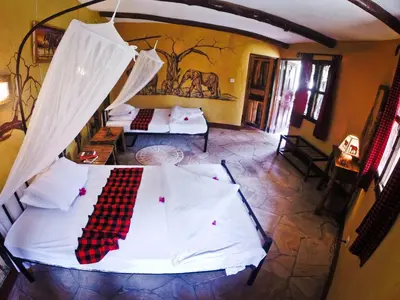 an aerial view of a bedroom with two beds at NSYA CAMP MANYARA in Mto wa Mbu