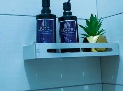 two bottles of alcohol sitting on a shelf at ILBORU HAVEN HOMEs in Arusha
