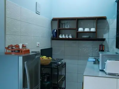a kitchen with a sink and a stove in it at ILBORU HAVEN HOMEs in Arusha