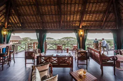 a view of a restaurant with tables and chairs at Lake Ndutu Luxury Tented Lodge in Sinoni