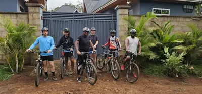 a group of men posing for a picture with their bikes at Moshi Epic Accommodation in Moshi