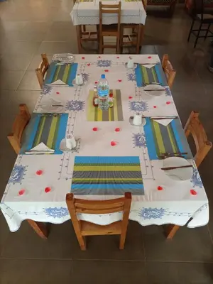 a table with a table cloth on top at STC.SAFARI LODGE in Oldeani