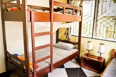 a bunk bed room with two bunk beds in it at BABA AFRICA HOSTEL in Arusha
