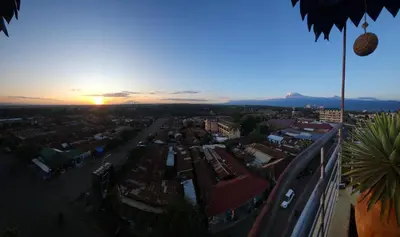 an aerial view of a city at sunset at Janibichi Adventures hostel in Moshi