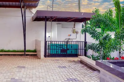 a gate to a house with a swimming pool at Hellen's Riverside villas in Moshi