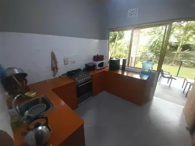 a kitchen with a stove and a counter with a window at Unique Heritage in Arusha