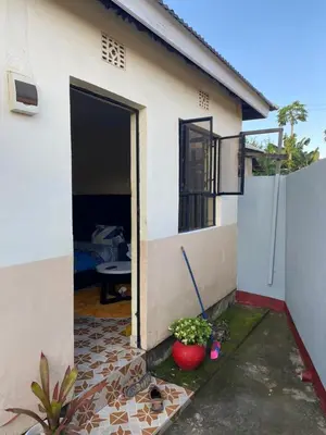 a house with a door open to a patio at Maasaifari Osmlai in Arusha