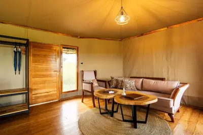 a living room with a couch and a table at Salinero Serengeti in Ututwa