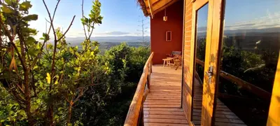 a wooden walkway to a house with a view at Mamadunia Safari Lodge in Karatu