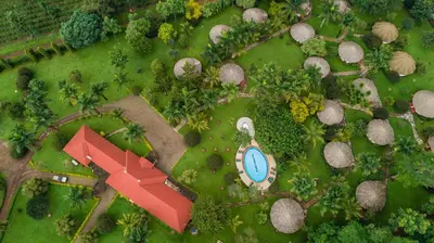 an overhead view of a house with a pool in a yard at KILEMAKYARO Mt LODGE in Uru