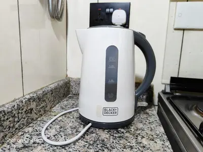 a tea kettle sitting on a counter next to a stove at Twiga Luxe in Arusha